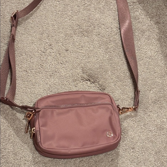 lululemon athletica Handbags - Lululemon everywhere crossbody bag- rose color/rose gold hardware